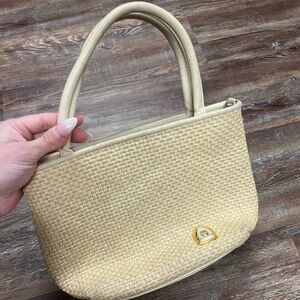 Cream woven Etienne Aigner bag with gold hardware